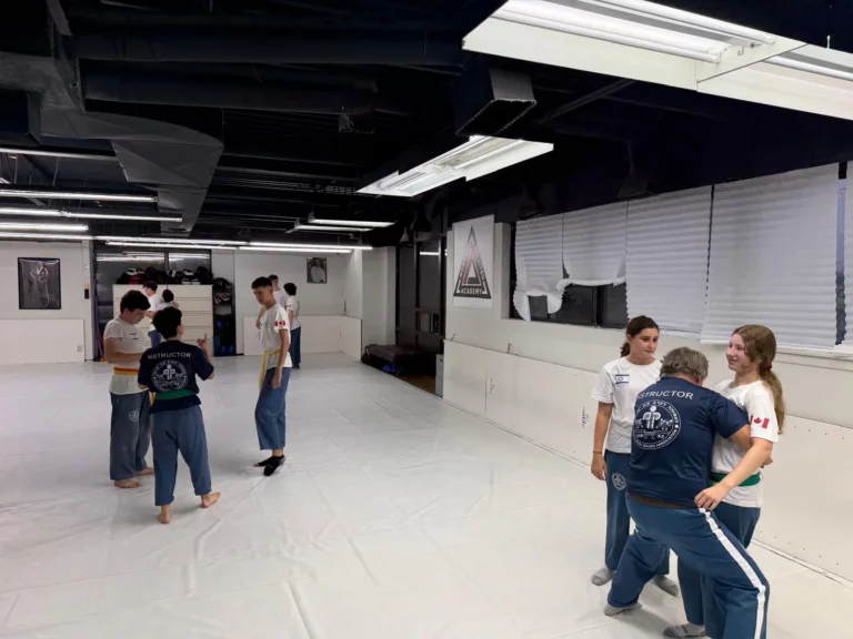 Students working in pairs on the training floor