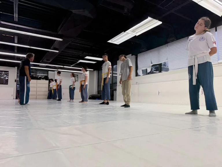 Students standing ready during a Krav Maga class